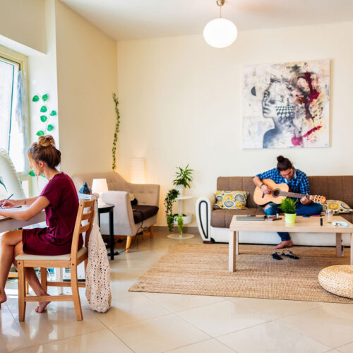 wolfcreek-condos-students-working-in-living-room wolfcreek-condos-students-working-in-living-room